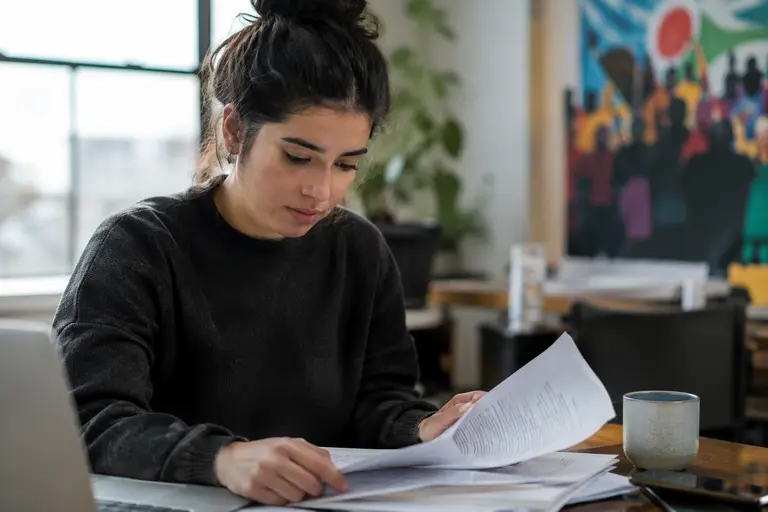 A person reviewing legal documents before posting online